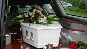 a white coffin in a hurst